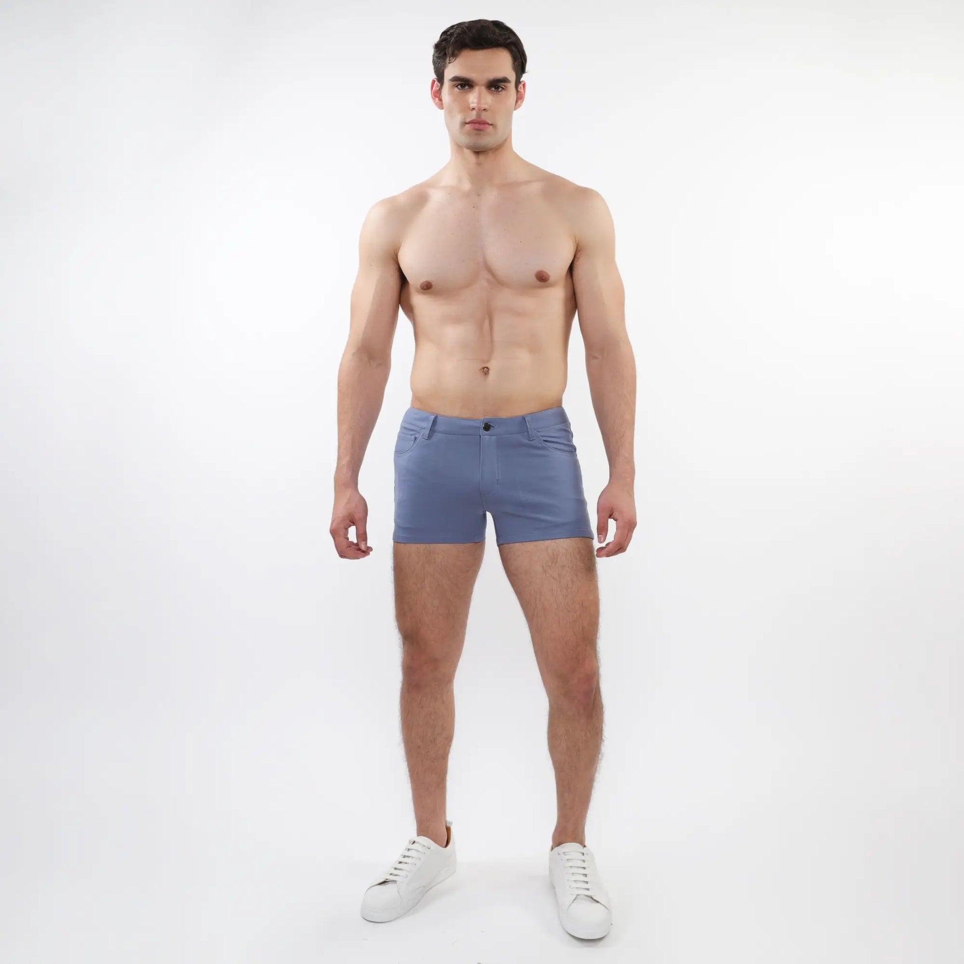A pair of men’s light blue slim-fit 3 inch stretch knit shorts with five-pocket design and button closure