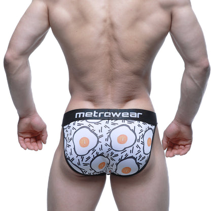 White men’s briefs with fried egg pattern and black trim featuring metrcwear brand on waistband metroMaleWear Sunny Side Bikini 3004-55