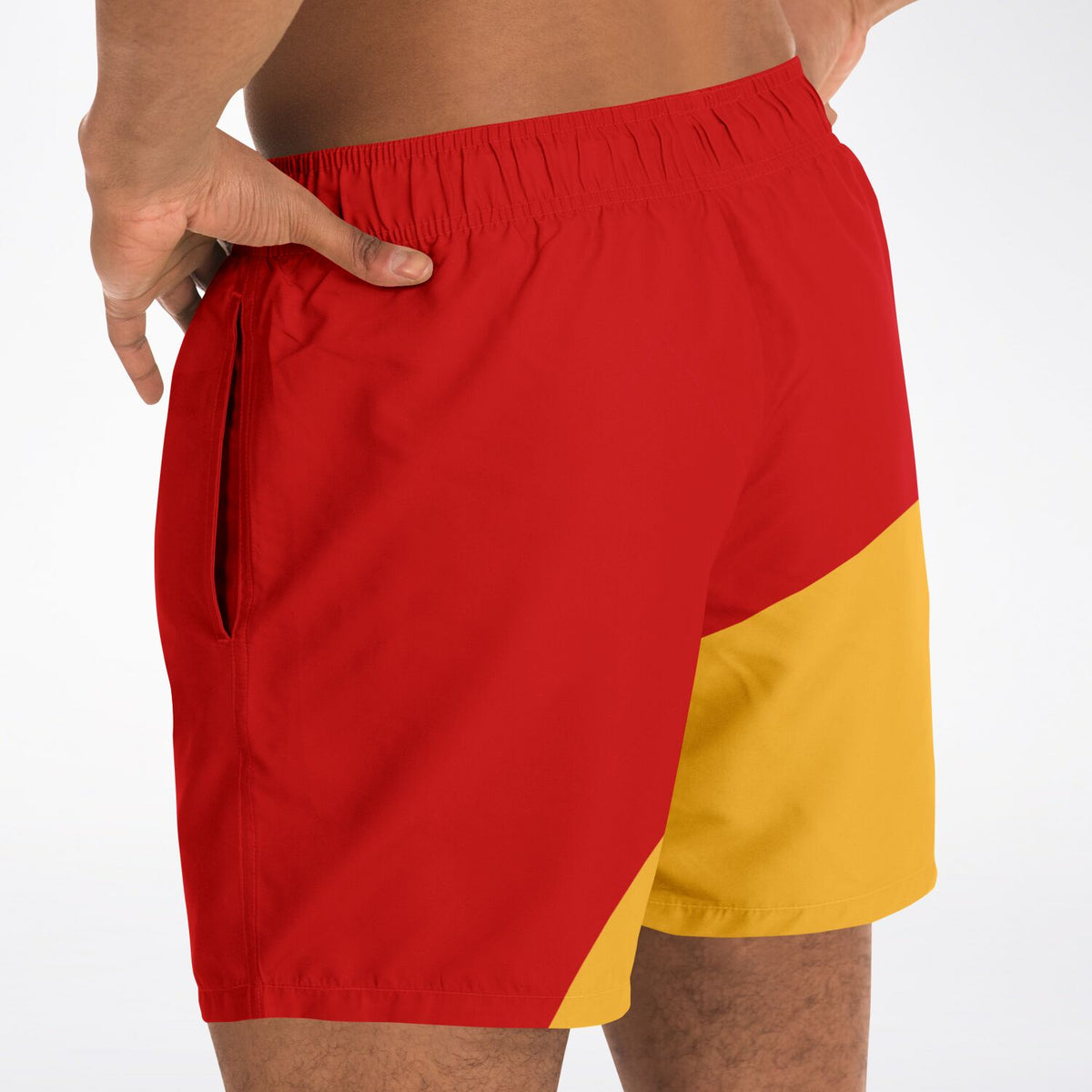 Men's swim shorts by Maris Equi in red and yellow with a color-block design featuring an elastic waistband and side pockets.