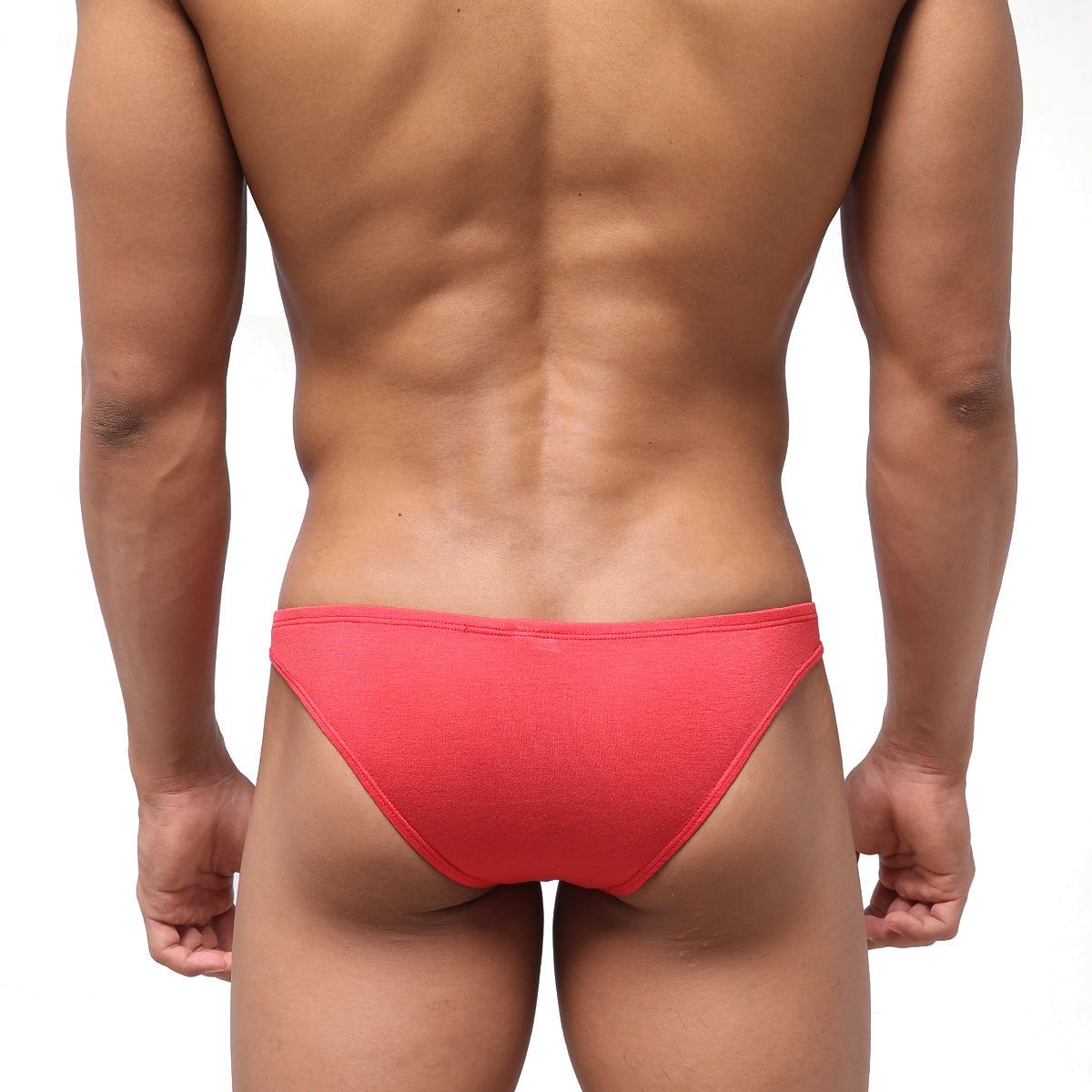 Bright coral-red metroMalewear bosillo half back bikini briefs with textured seamless fabric shown from the back side