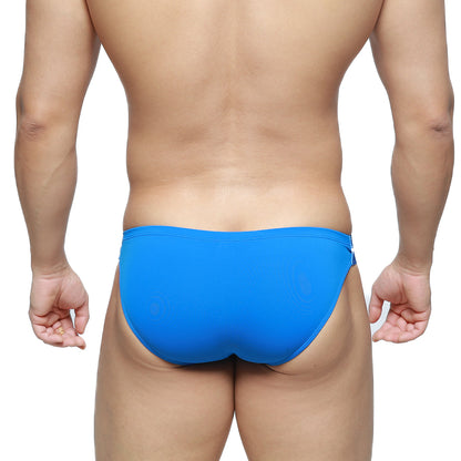Bright blue MetroMaleWear Brief 2.0 one-piece swim trunks with sleek smooth fabric finish for swimming use