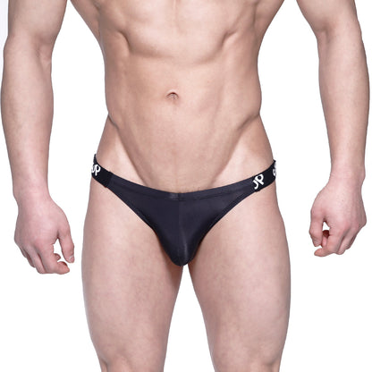 Black sleek form-fitting metro malewear sup bikini briefs with subtle white logo on waistband