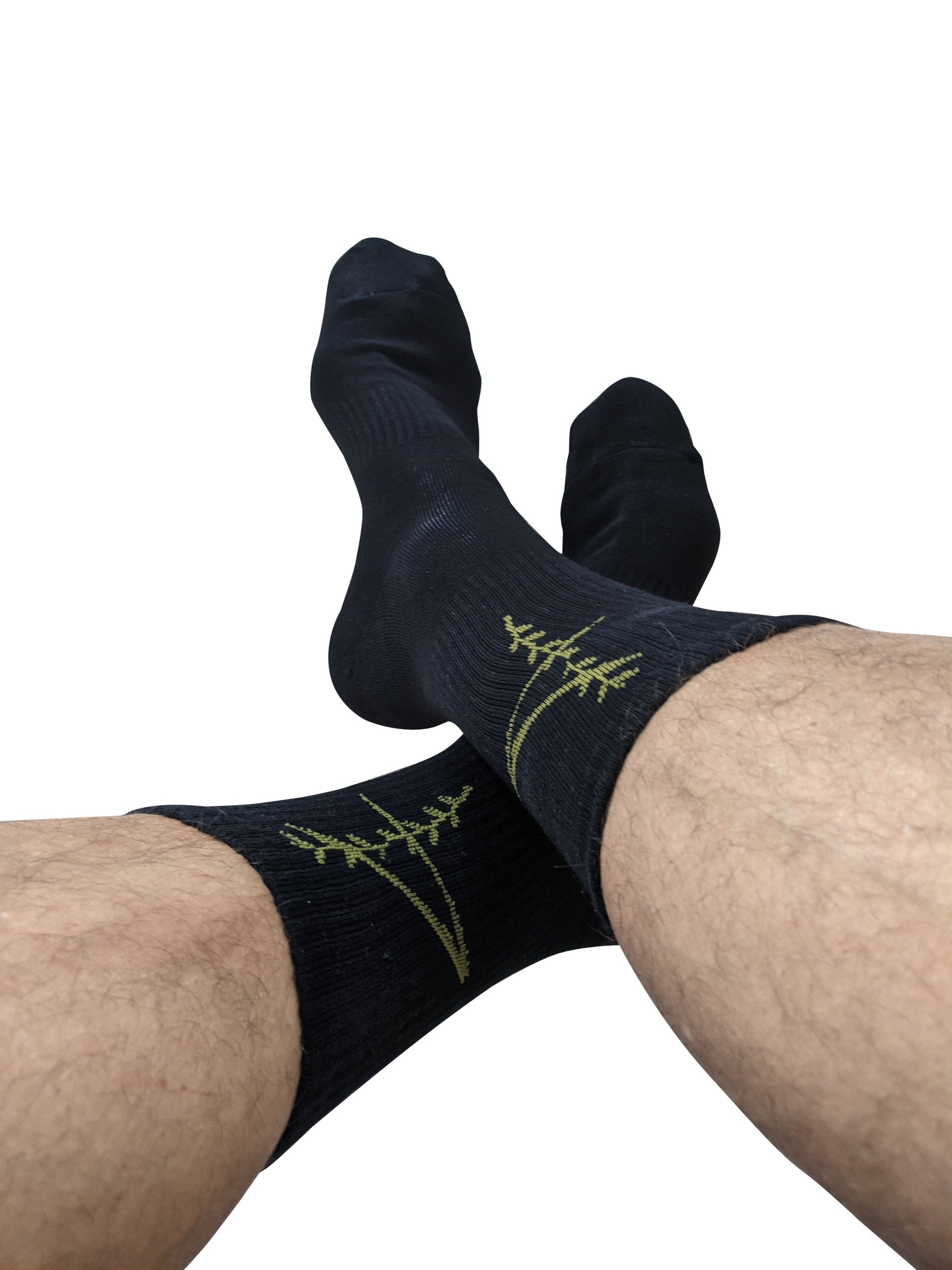 Black sport crew socks with subtle green fern embroidery on the side for comfortable active wear
