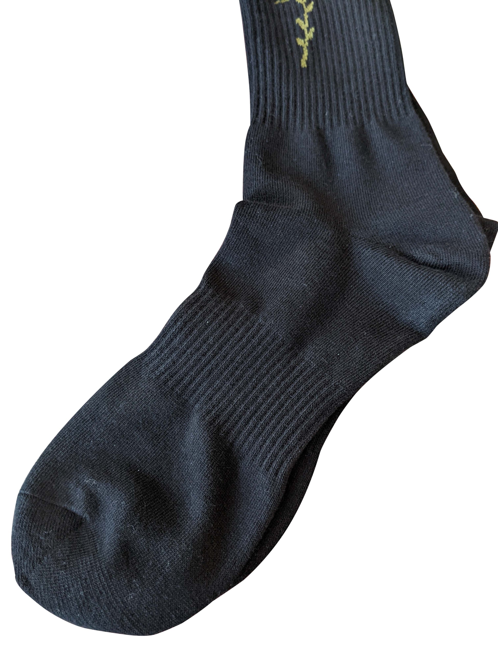 4 rth black sport sock made of ribbed knit fabric with an olive green vine embroidery near the cuff