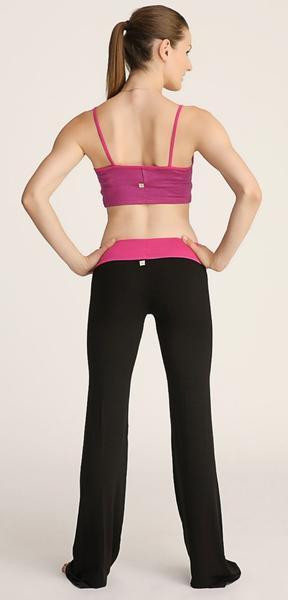 A vibrant magenta sports bra with thin straps and matching waistband paired with sleek black 4-rth women’s classic yoga pant