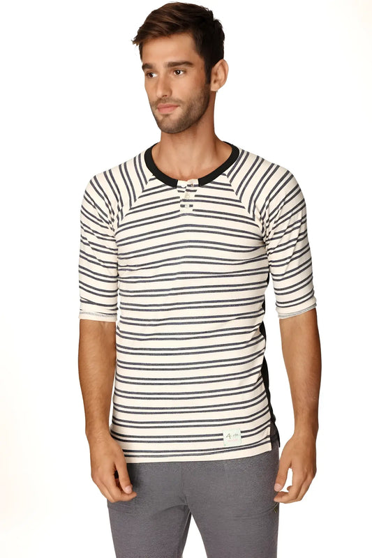 A mens short-sleeved cream and navy striped henley shirt with black ribbed collar and button placket in french terry