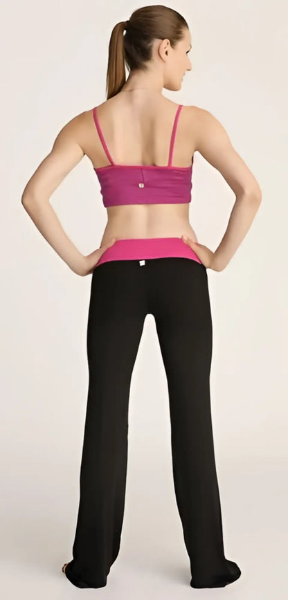 A vibrant magenta sports bra with thin straps and matching waistband paired with sleek black 4-rth women’s classic yoga pant