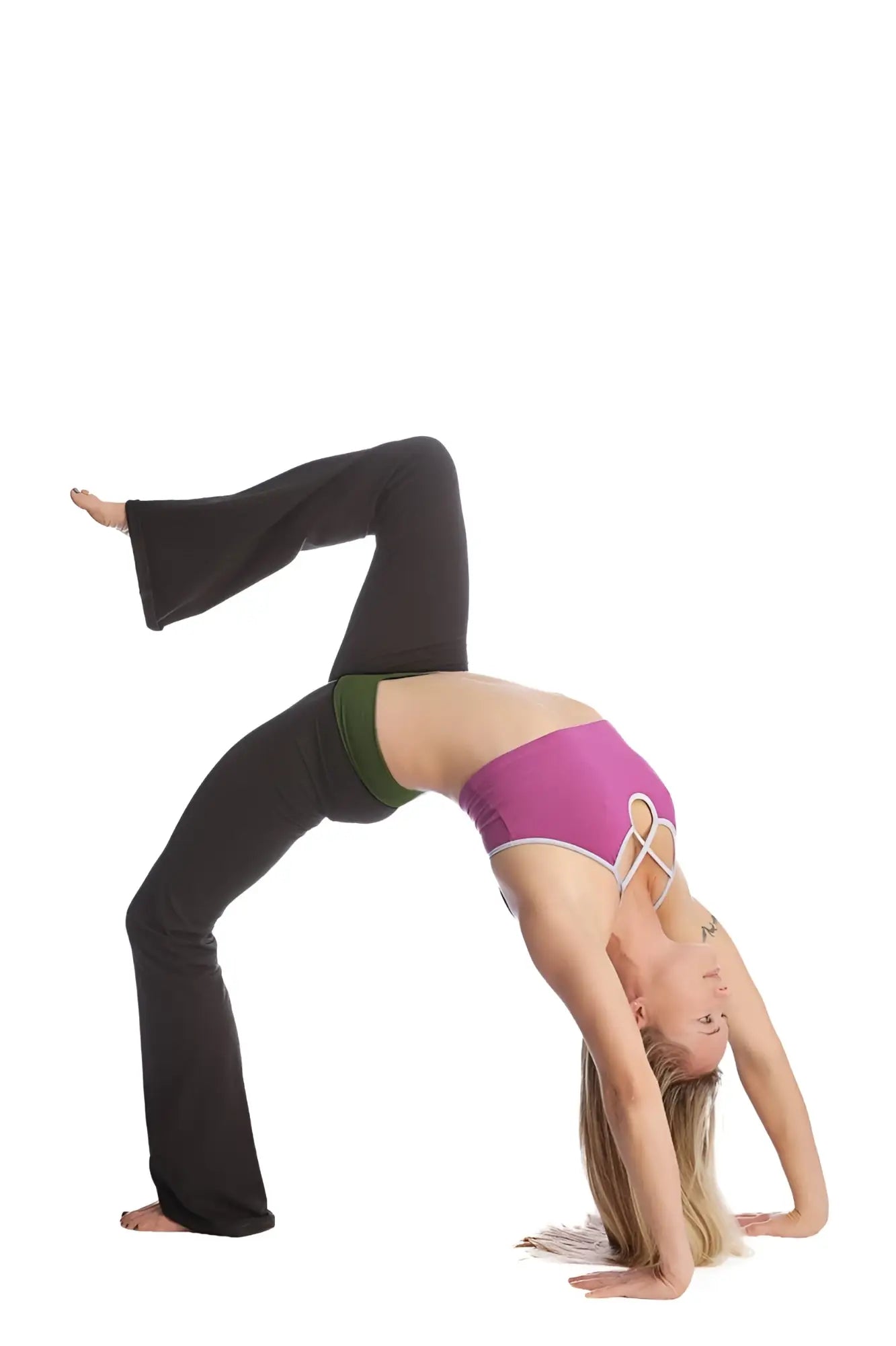 A woman performs an advanced bridge pose wearing 4-rth women’s classic black flared yoga pants and a purple sports bra