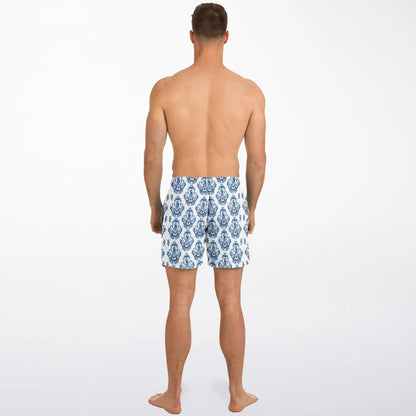Men's swim shorts in blue and white baroque pattern made by Maris Equi shown from the back on a model.