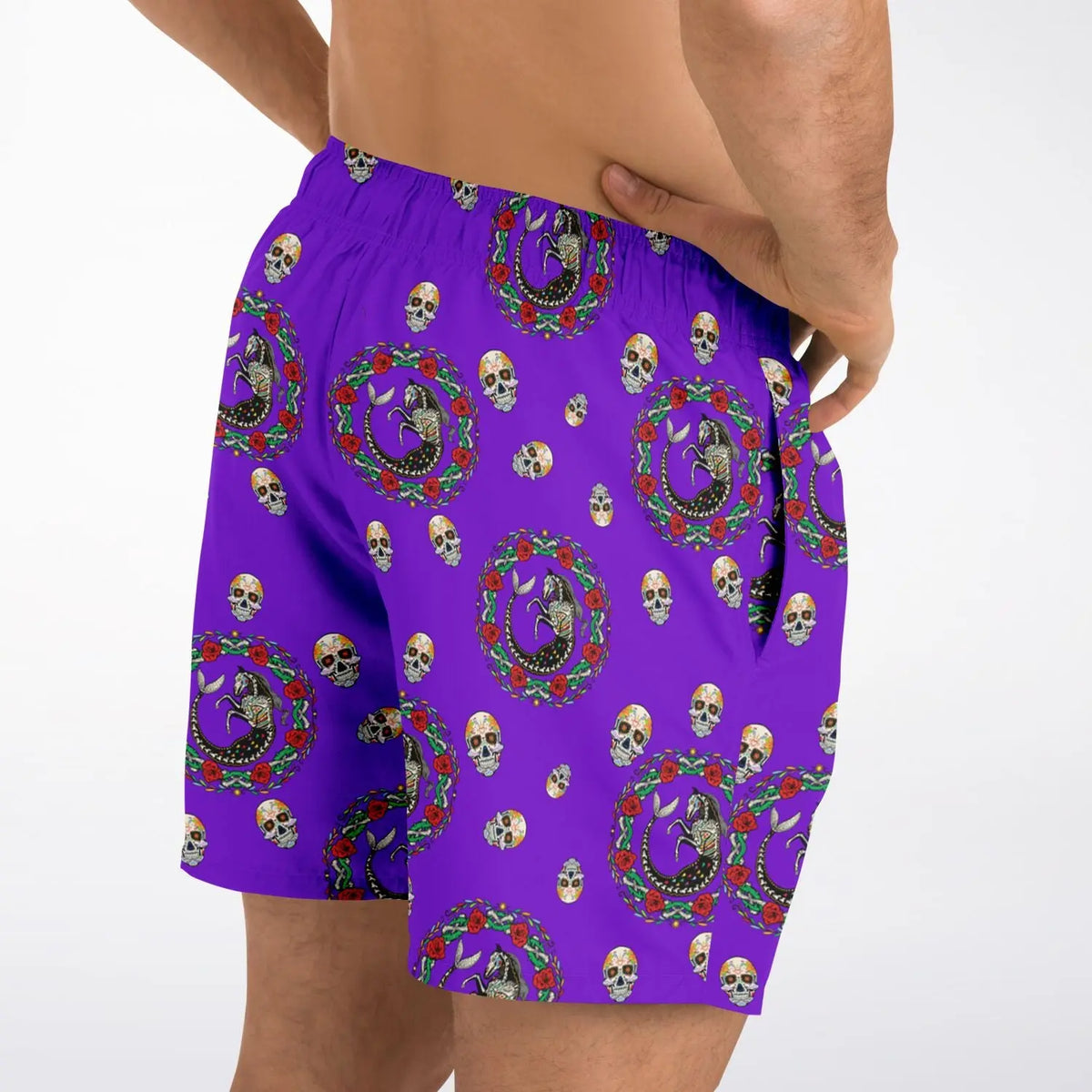 Purple men's swim shorts with Day of the Dead skull and floral pattern made by Maris Equi featuring an elastic waistband.