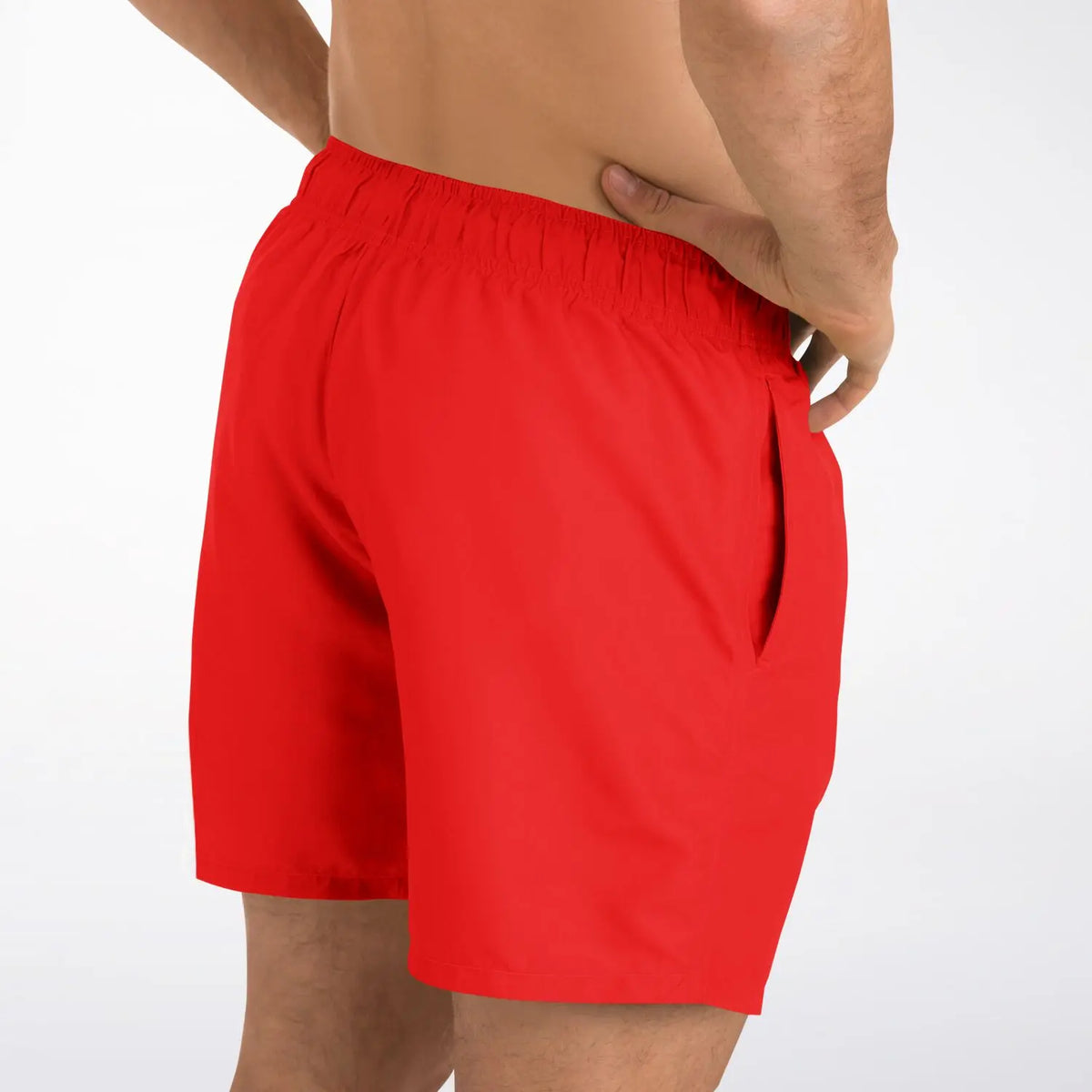 Red men's swim shorts by Maris Equi featuring an elastic waistband and side pockets shown from the back.