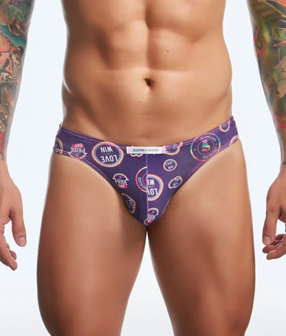 Justin + Simon classic mens bikini briefs in purple with pride day love and win text and rainbow design pattern