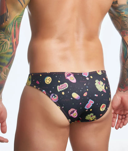 Black swim trunks from Justin plus Simon classic mens bikini with vibrant smiling faces and colorful space-themed prints
