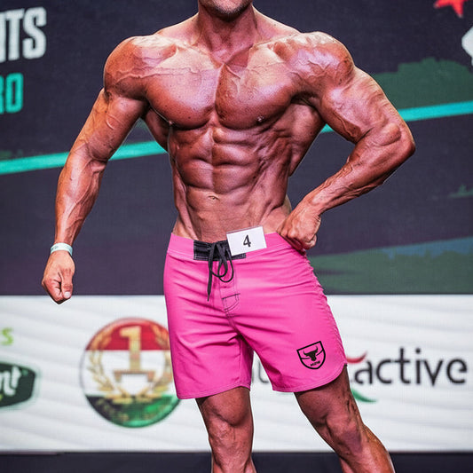 MetroMaleWear physique board short pink 4706-01 with bright pink fabric black drawstring and shield logo on lower right leg