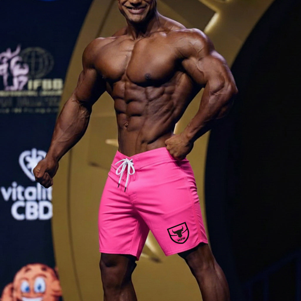 MetroMaleWear physique board short neon pink with white drawstring and black shield logo on lower left leg