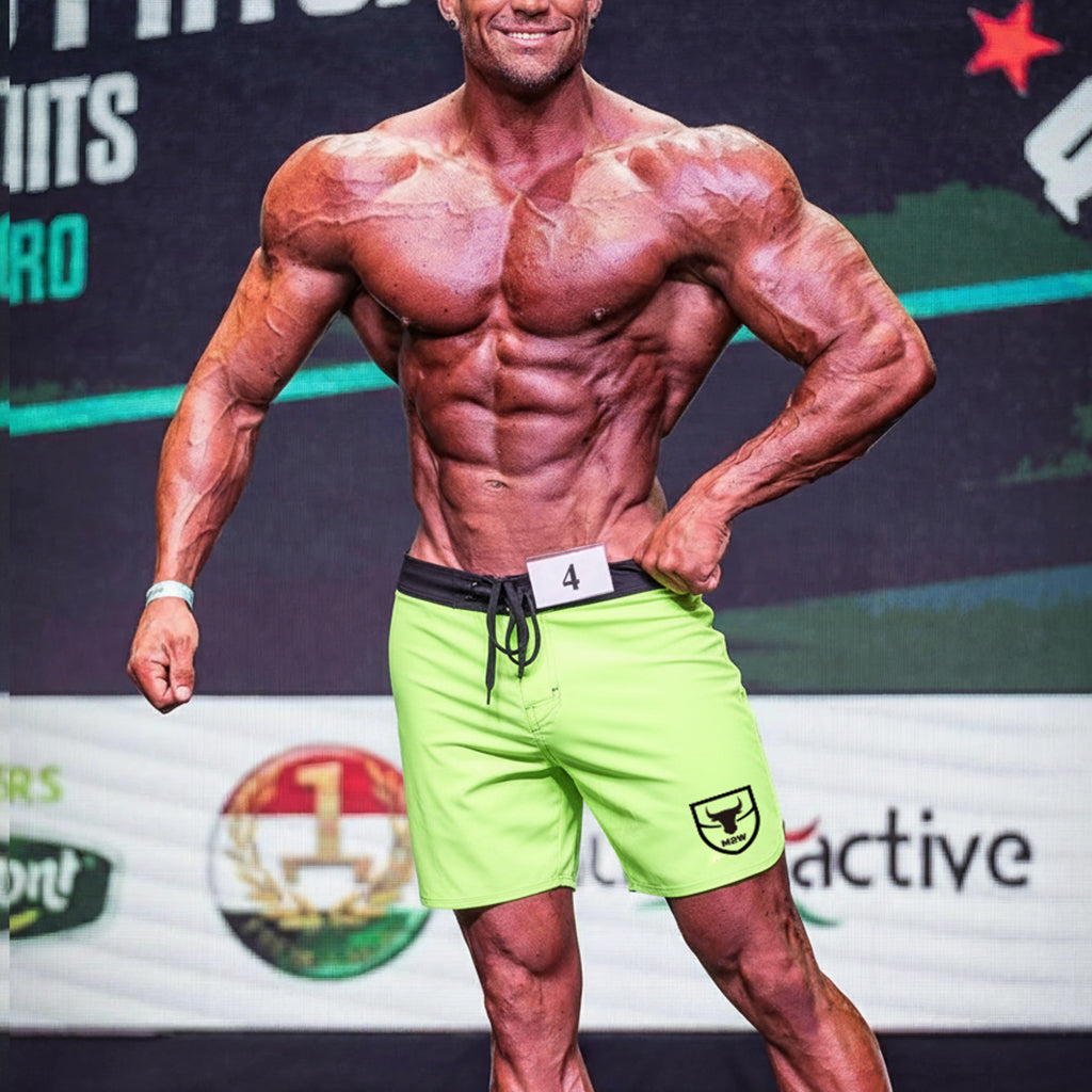 MetroMaleWear physique board short lime-black with bright neon green fabric, black waistband, drawstring, and shield logo