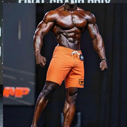 MetroMaleWear Physique board short neon orange with white drawstring and black logo patch for athletic use
