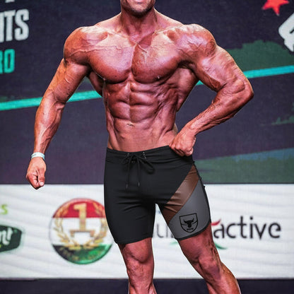 Black and gray athletic board shorts with bold bull logo on the side from MetroMaleWear MetroMuscleWear Cafe Physique