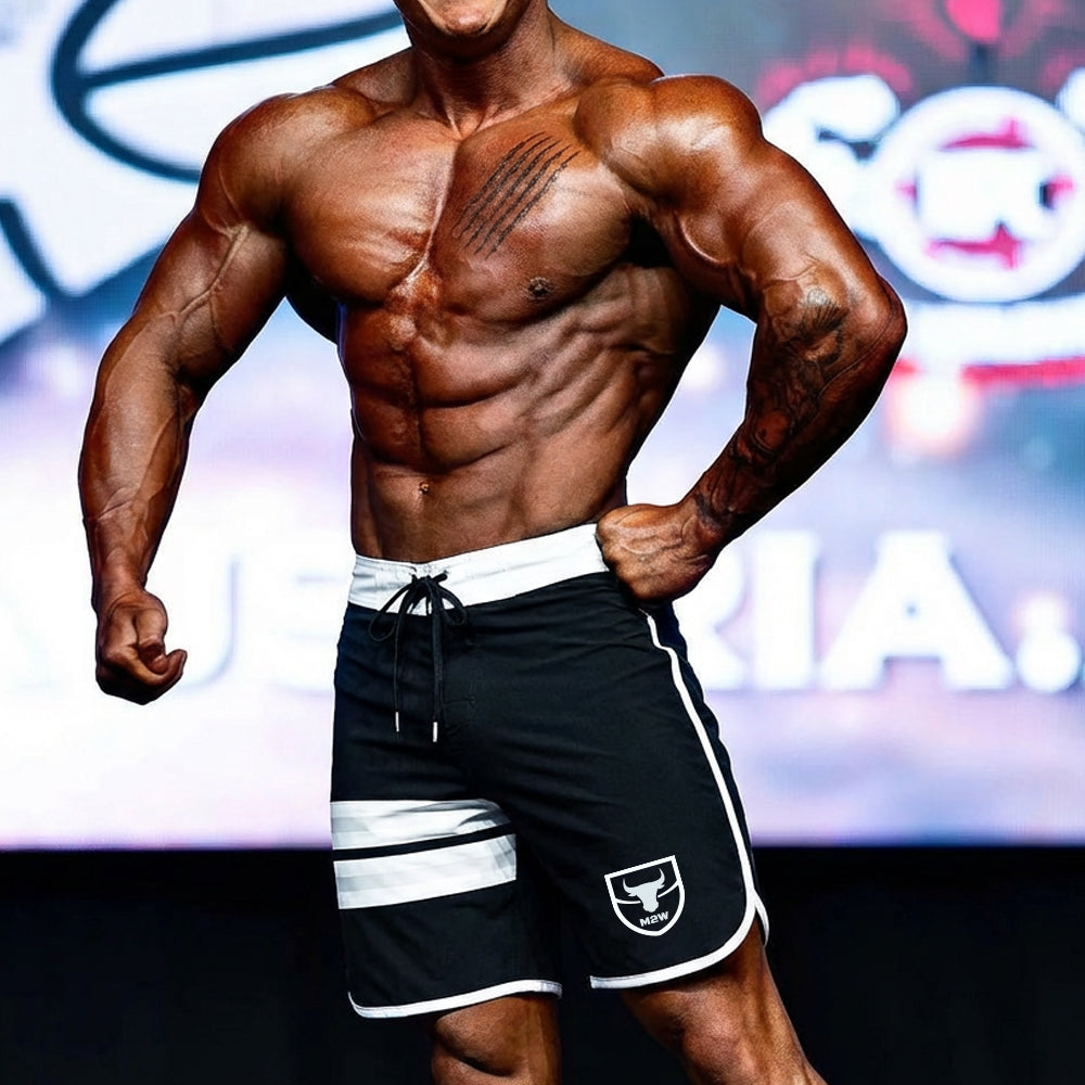 Black athletic MetroMaleWear MetroMuscleWear physique board shorts with white trim and bull logo on lower left leg