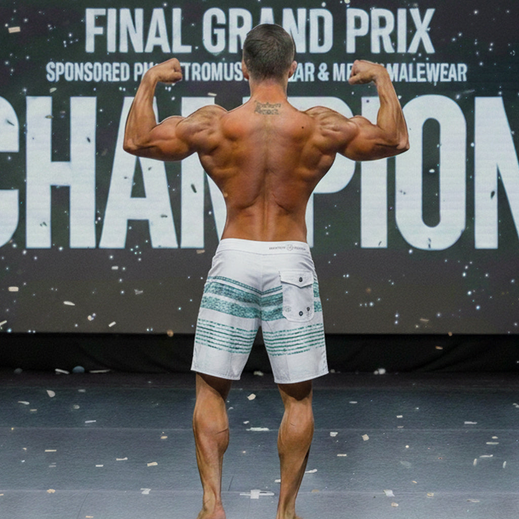 White board shorts with teal horizontal stripes and front pocket from metronealewear metroMuscleWear innocent physique collection