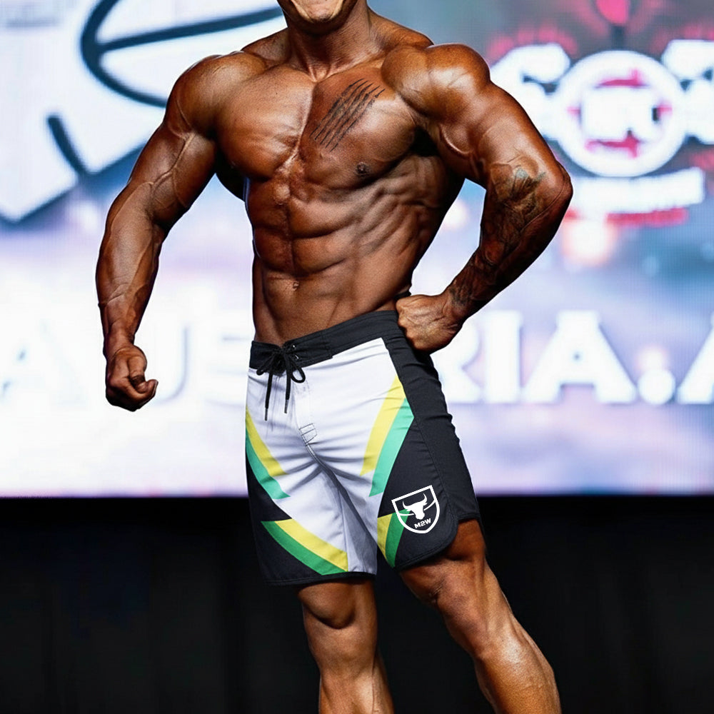 MetroMaleWear MetroMuscleWear IFBB Pro mens physique board short in black white and green with bold diagonal stripes and shield logo