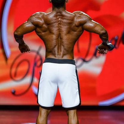 A muscular man’s back wearing white athletic shorts with black trim from metromalewear metromusclewear ifbb pro mens physique board short gradient 4717-72