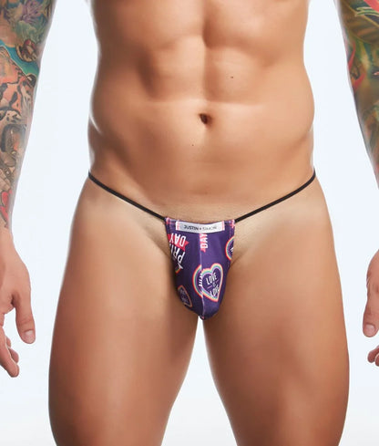 Purple patterned thong with black elastic waistband and heart design featuring justin kimmel branding from justin + simon classic g-string bulge fun prints