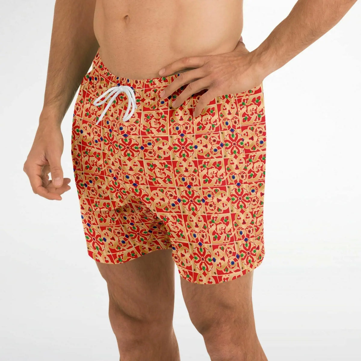 Men's swim shorts by Maris Equi in a vibrant red and orange geometric pattern featuring an elastic waistband and drawstring.