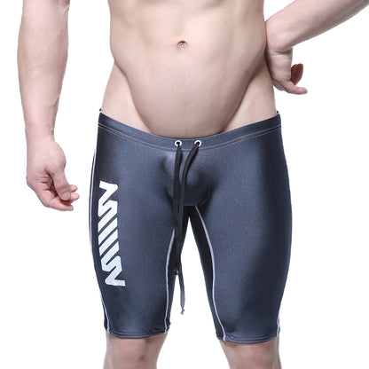 Dark gray sleek form-fitting metroMalewear jammer swim boxer with white vertical branding and contrasting stitching