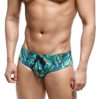 MetroMaleWear classic swim brief jungle 4914-08 men’s swim trunks with vibrant teal and green tropical leaf pattern and black drawstrings