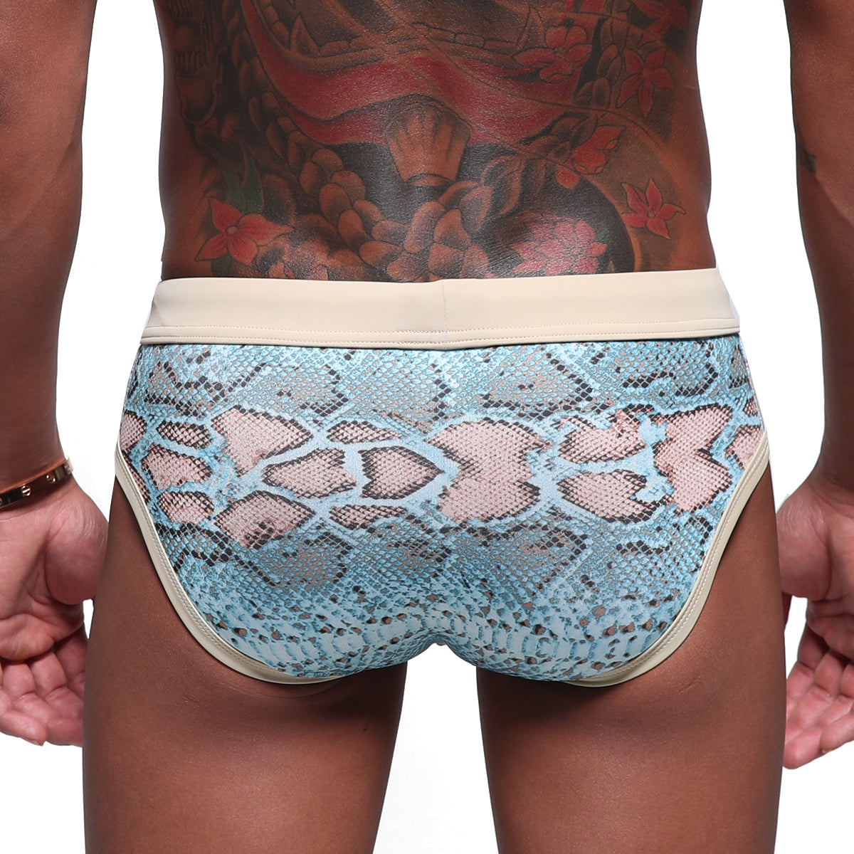 Metro male wear piton swim brief turquoise features light blue snake-print men’s briefs with beige trim