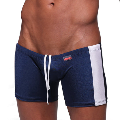 Navy blue MetroMaleWear Extreme Square swim trunks with white side stripes and matching drawstring waistband