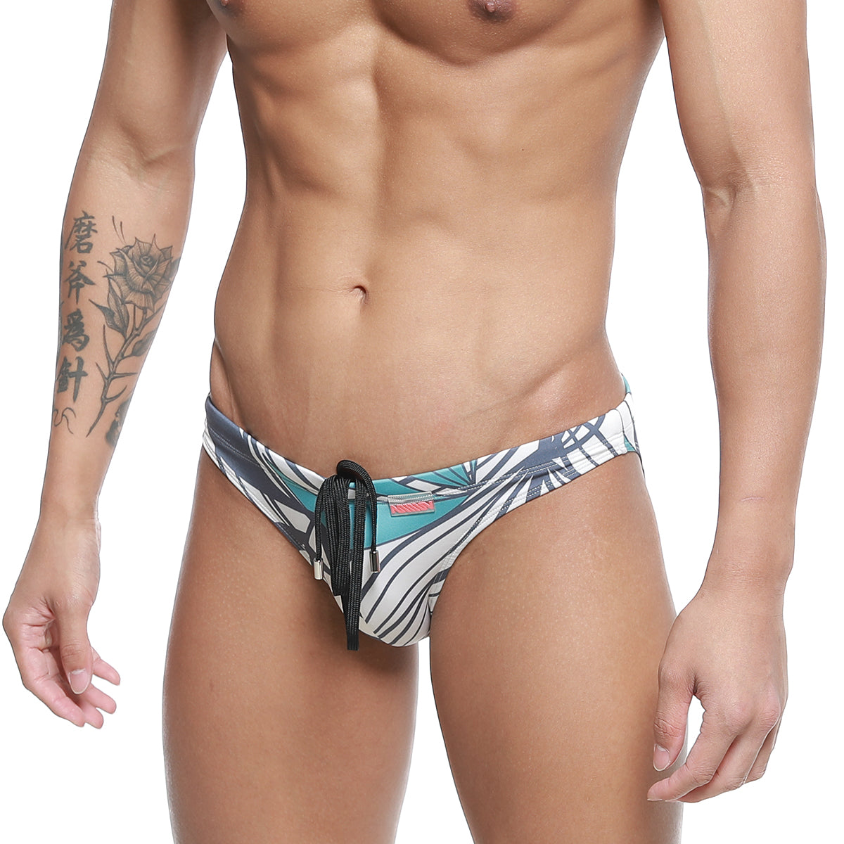 MetroMalewear classic swim bikini meadow 4937-09 men’s swim trunks with bold teal black white tropical leaf pattern and black drawstring
