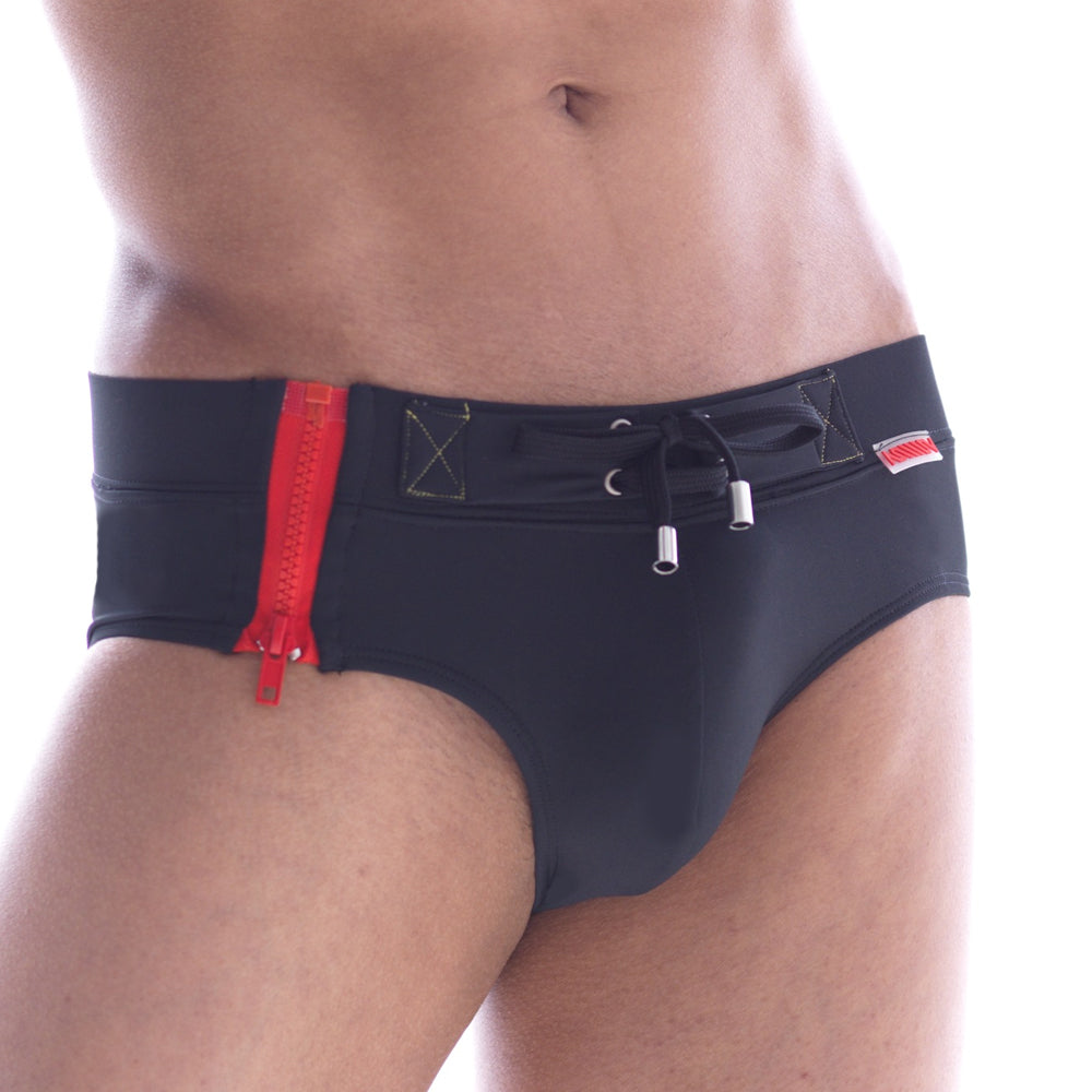 Black MetroMaleWear swim trunks with bold red side zipper and silver drawstring ties for stylish swimwear use