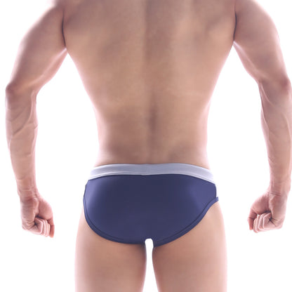 Navy blue MetroMaleWear STEEL swim brief with white waistband designed for comfortable swimwear use