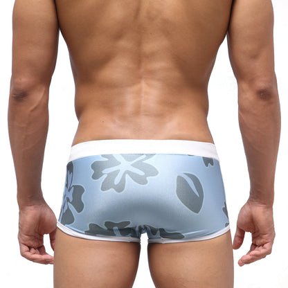 Light blue MetroMaleWear Fresco swim trunk briefs with gray floral pattern and white trim for natural comfort