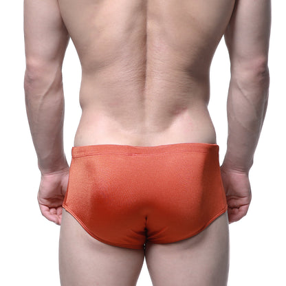 Metro male wear charlie swim brief in ochre orange with smooth slightly shiny fabric finish for swimming