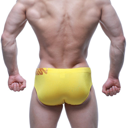 Bright yellow metroMalewear Rubio Swim Brief 4966-15 with subtle orange logo on waistband for athletic use