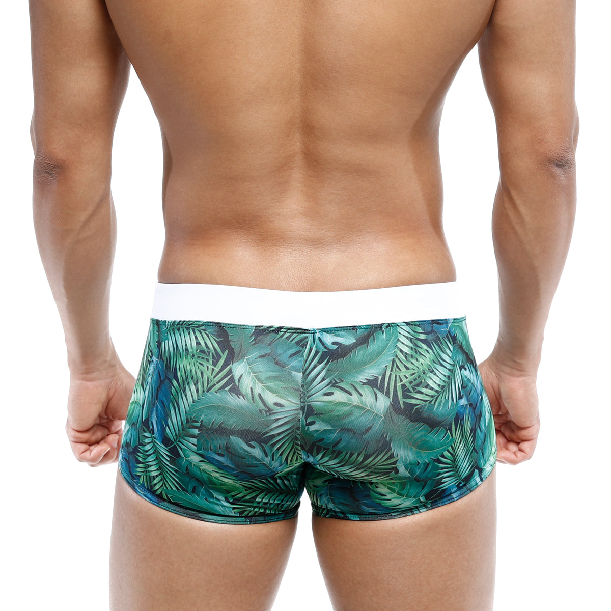 Green tropical leaf-patterned swim boxer briefs with white waistband by metromalewear for jungle adventures