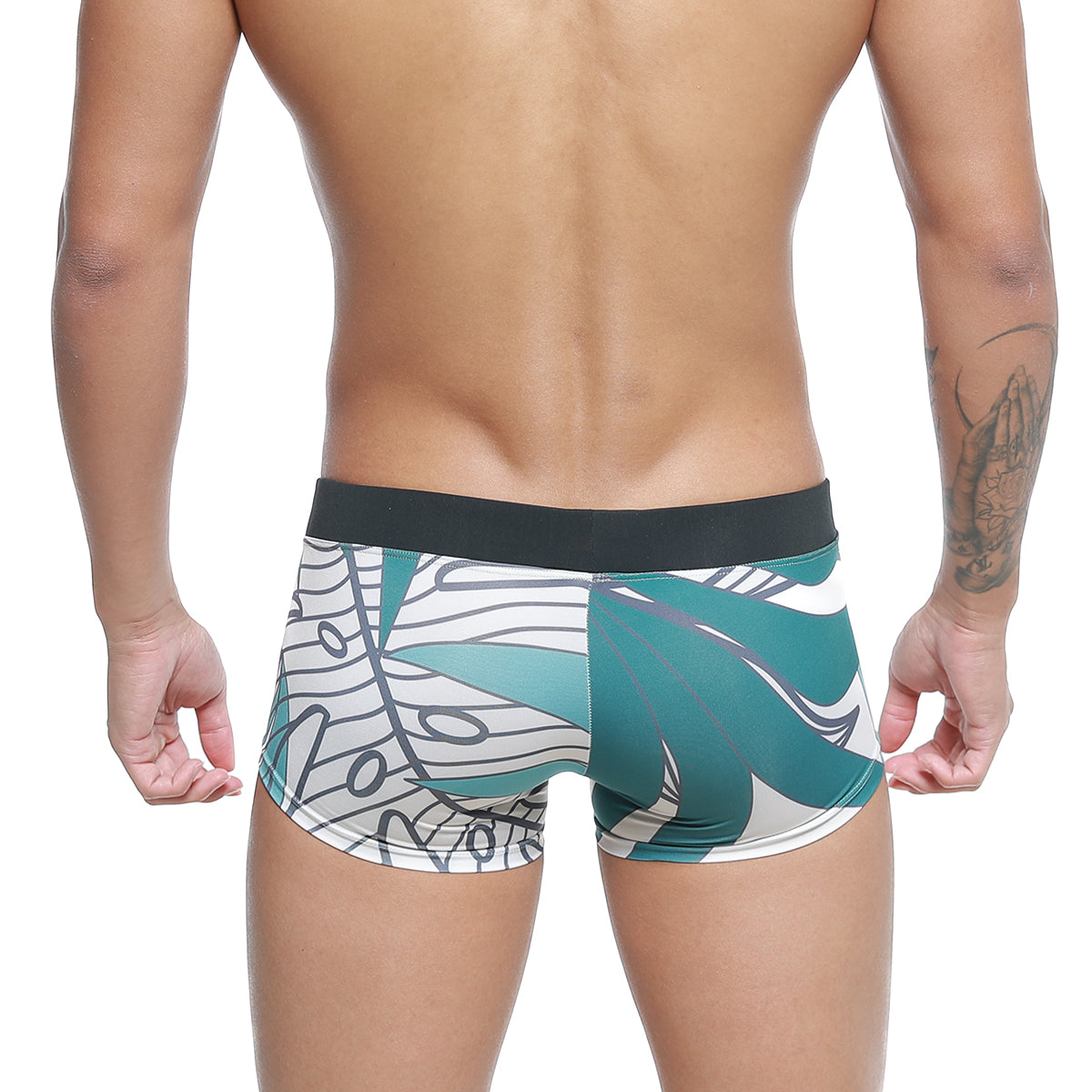 Teal and white tropical leaf patterned metro malewear profundo swim boxer briefs with black elastic waistband