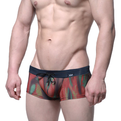 MetroMaleWear fire swim boxer briefs with vibrant red green yellow abstract pattern on sheer mesh and navy waistband