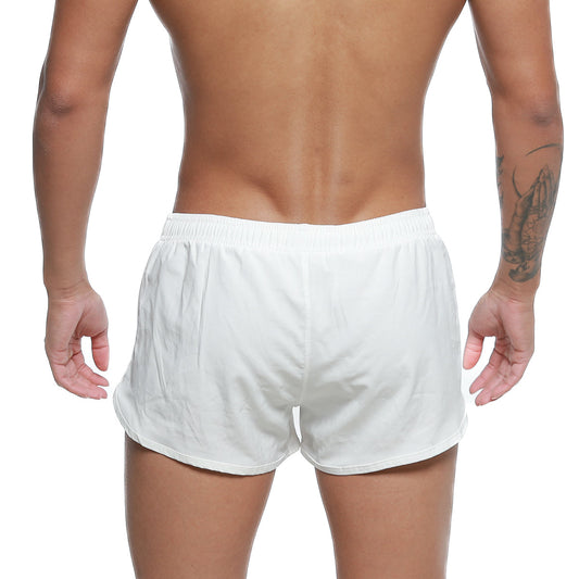 White athletic swim shorts with elastic waistband and relaxed fit by metromalewear for summer use