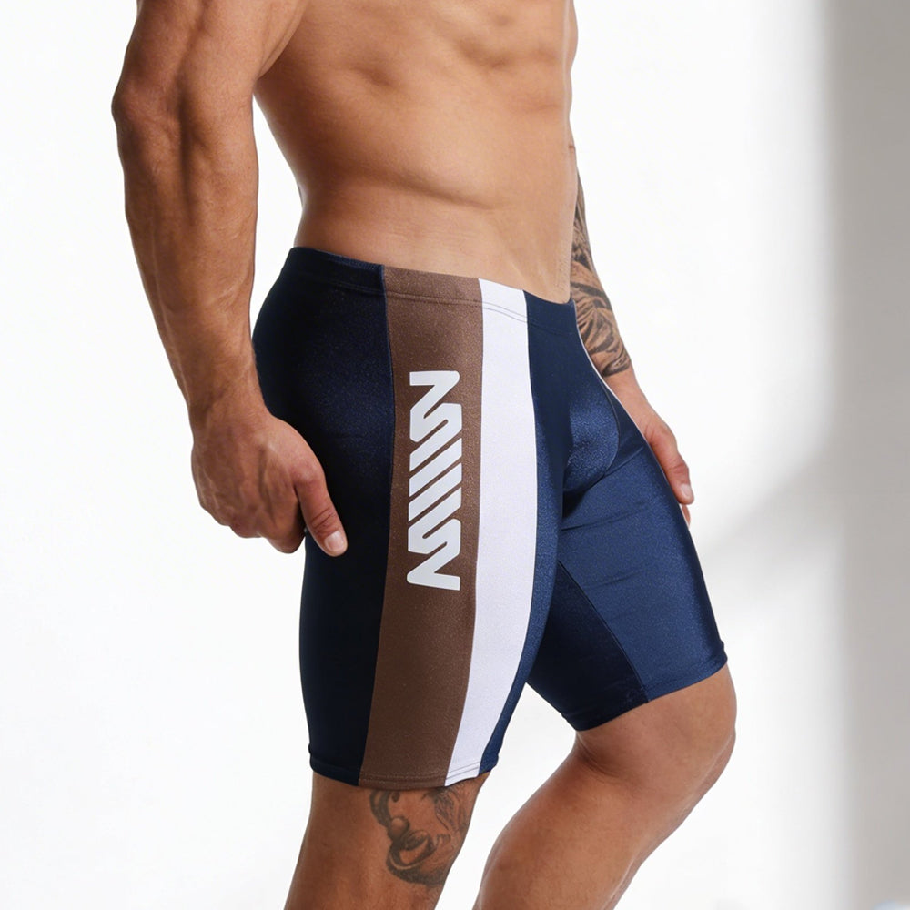 Navy blue and brown jammer swim boxer by metromalewear with white vertical stripe and bold m logo