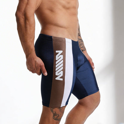 Navy blue and brown jammer swim boxer by metromalewear with white vertical stripe and bold m logo