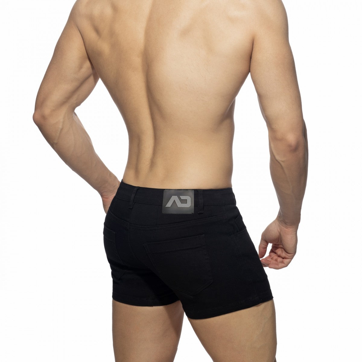 Black 5 pockets summer shorts with sleek form-fitting design and subtle gray logo patch at the waistband