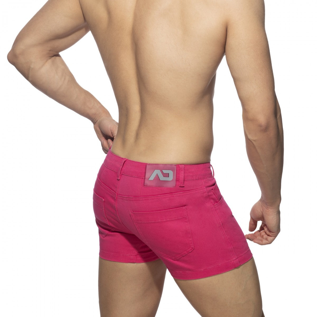 Bright pink 5 pockets summer shorts showing back side with gray logo patch on waistband for casual wear