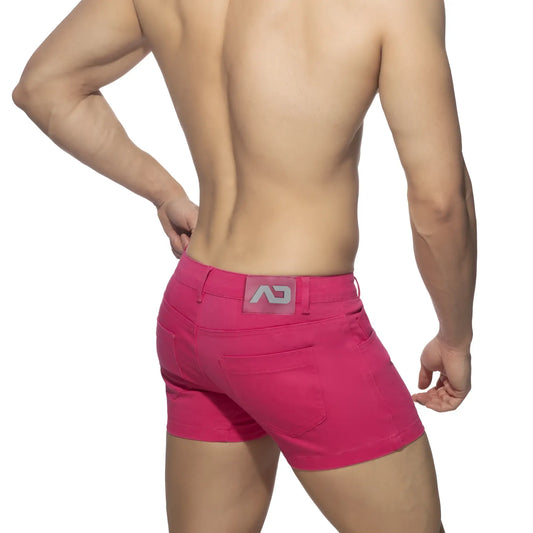 Bright pink 5 pockets summer shorts showing back side with gray logo patch on waistband for casual wear
