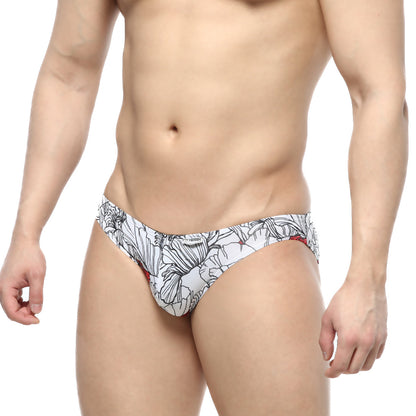 White swim trunks with black floral patterns and red accents from metromalewear colorado jock strap escobar 5011-09