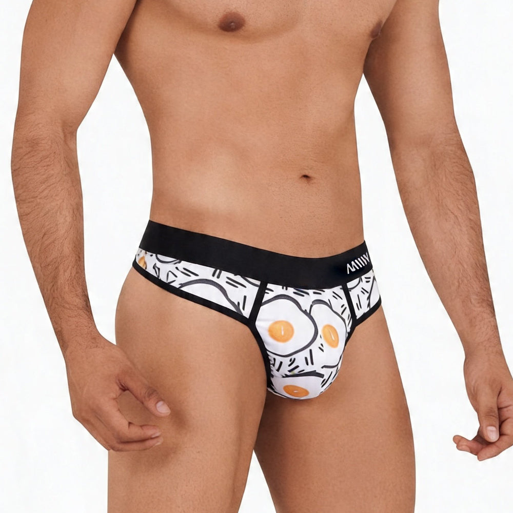 White briefs with black waistband and orange black fried egg pattern metroMalewear sunny side thong 5012-41