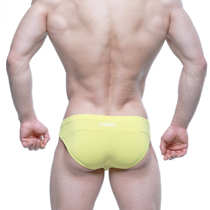 Bright yellow metro malewear aluche bikini briefs with subtle white logo on waistband for men